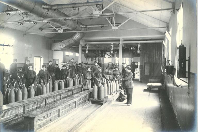 Munitions workers filling shells